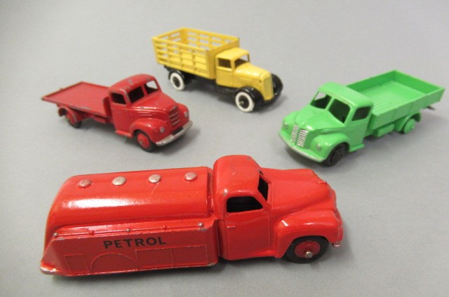 Twenty early Dinky vehicles including saloon cars Image