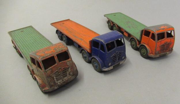 Twelve unboxed Dinky wagons including Guy flat beds and vans Image