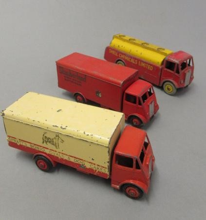 Twelve unboxed Dinky wagons including Guy flat beds and vans Image