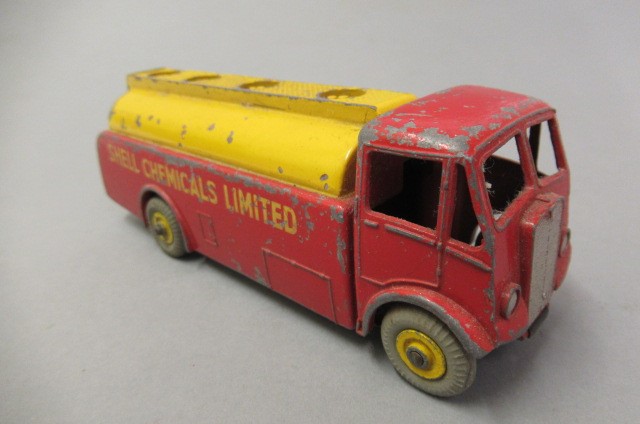 Twelve unboxed Dinky wagons including Guy flat beds and vans Image
