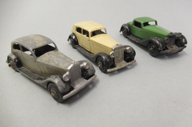Fifteen playworn early Dinky saloon cars Image