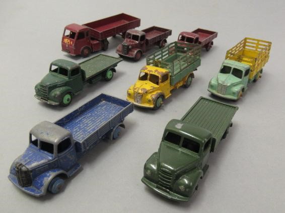 Fourteen playworn Dinky vehicles including wagons Image