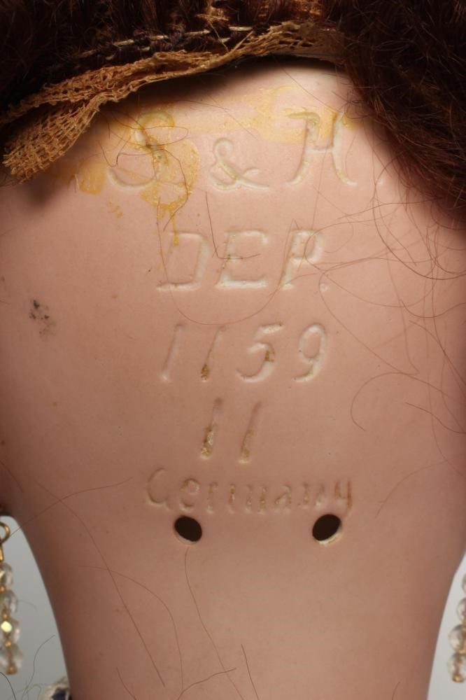 A Simon & Halbig bisque socket head doll Image