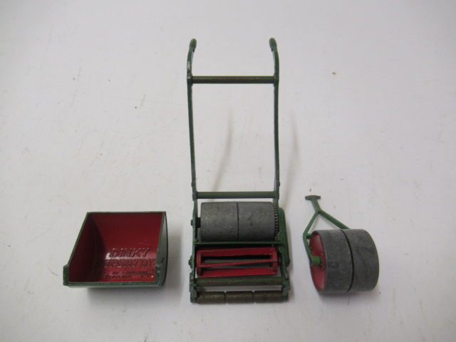 Dinky lawn mower with bin and garden roller Image