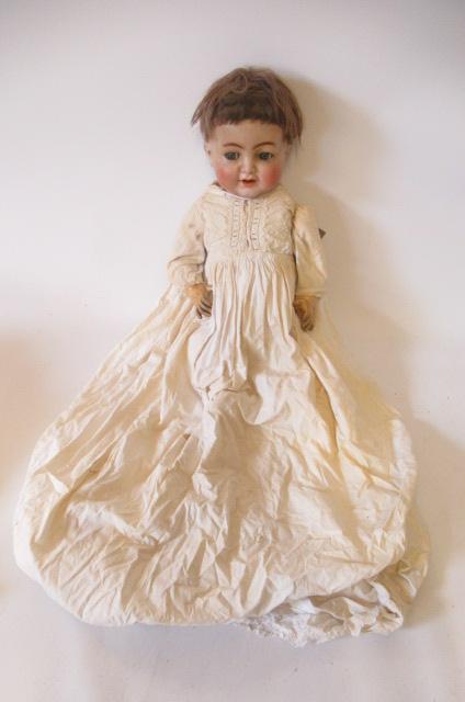 A Simon & Halbig bisque socket head flirty character doll Image