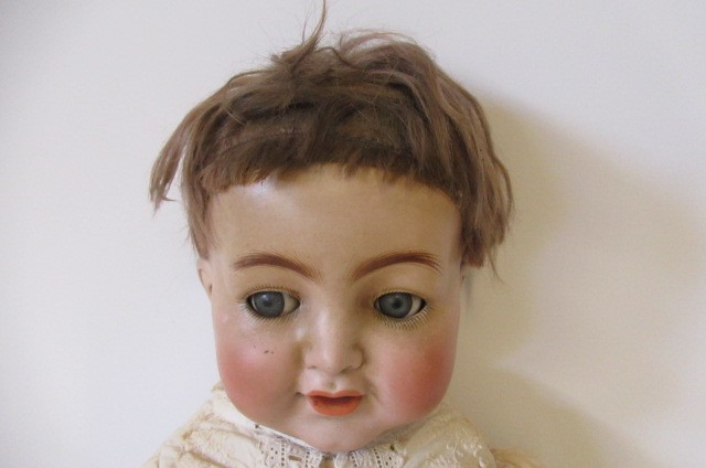 A Simon & Halbig bisque socket head flirty character doll Image