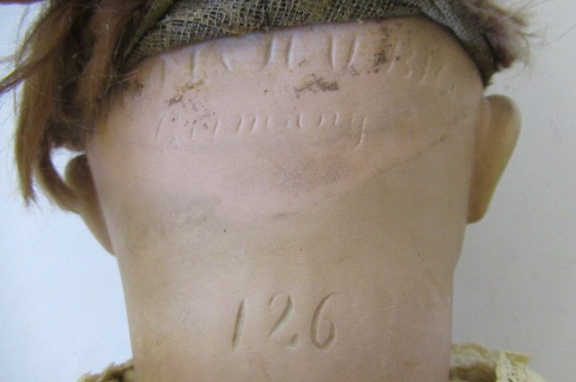 A Simon & Halbig bisque socket head flirty character doll Image