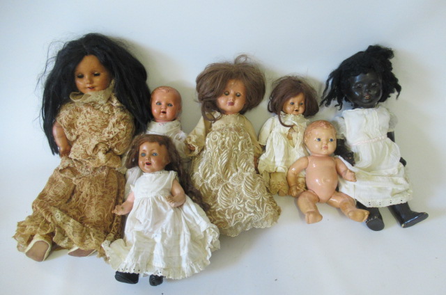 Seven composition dolls Image