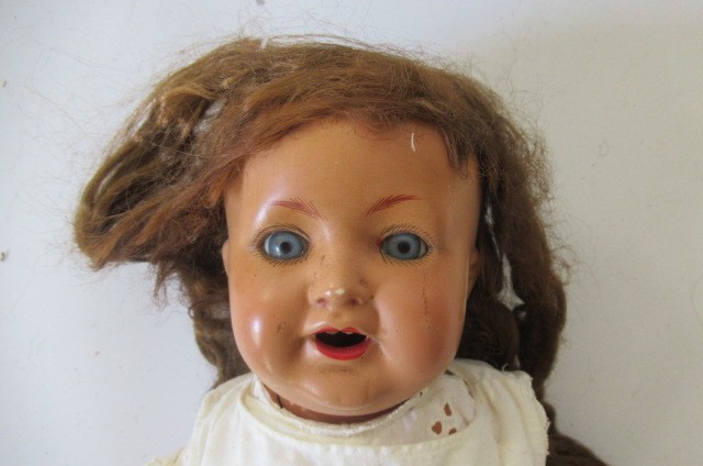 Seven composition dolls Image