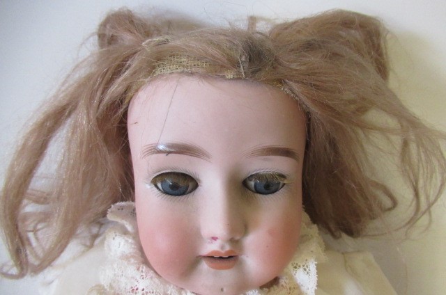 A Simon & Halbig bisque socket head doll Image