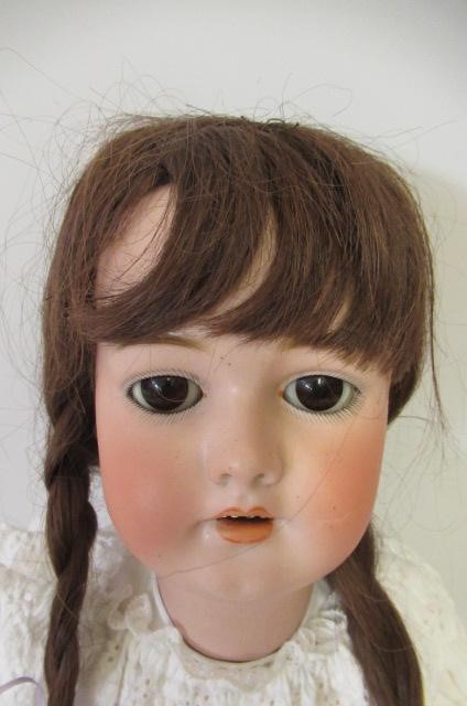 A Simon & Halbig bisque socket head doll Image