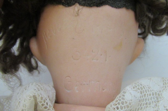 A Heubach Koppelsdorf bisque socket head doll Image