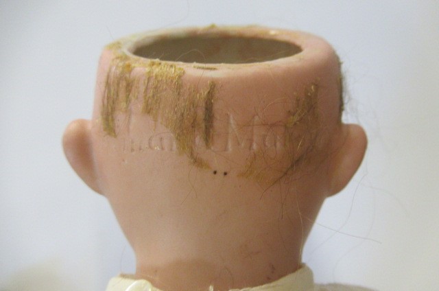 An Armand Marseille bisque shoulder head doll Image