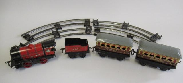 Four Chad Valley goods trucks and Hornby M1 Clockwork Passenger Train Set Image