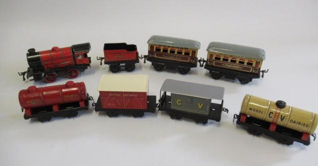 Four Chad Valley goods trucks and Hornby M1 Clockwork Passenger Train Set Image
