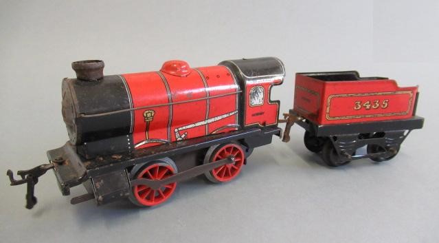 Four Chad Valley goods trucks and Hornby M1 Clockwork Passenger Train Set Image