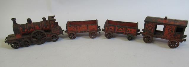 Wallworks Manchester cast iron floor train with locomotive and three wagons Image