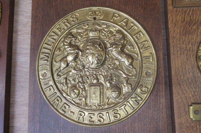 Vintage brass safe lock and manufacturers' plates including Milners' Patent Image