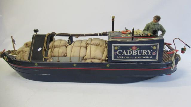 A battery powered radio controlled model of the narrow boat "Cadbury" Image