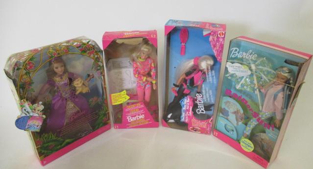 Four boxed Barbie dolls Image