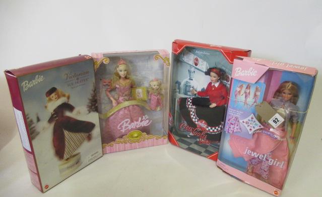 Four boxed Barbie dolls Image