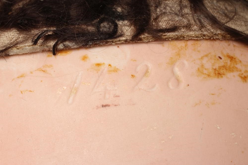 A Simon & Halbig bisque socket head character doll Image