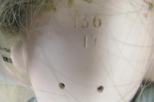 A German bisque socket head doll with blue glass sleeping eyes Image