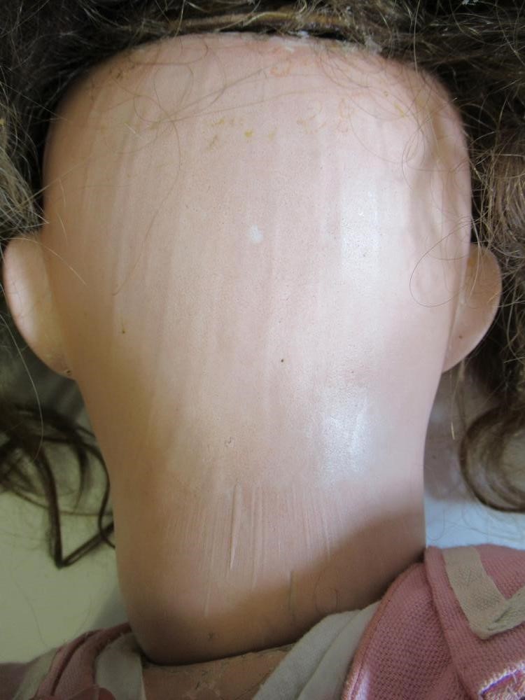 A large German bisque socket head doll Image