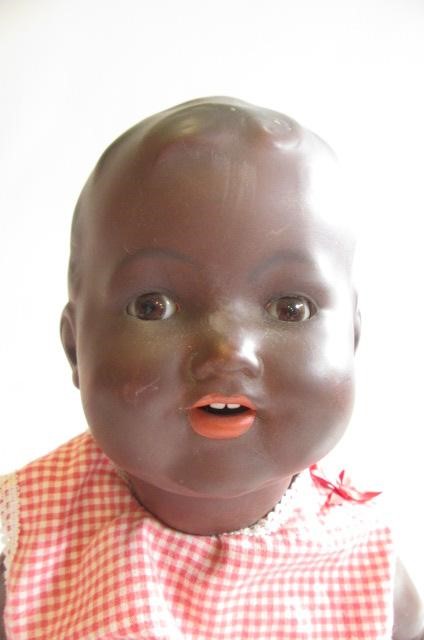 An Armand Marseille bisque socket head black baby doll Image