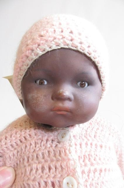 An Armand Marseille bisque socket head black baby doll Image