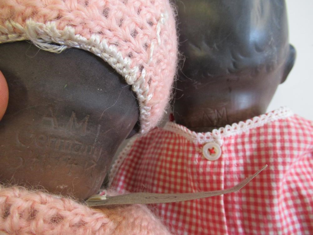 An Armand Marseille bisque socket head black baby doll Image