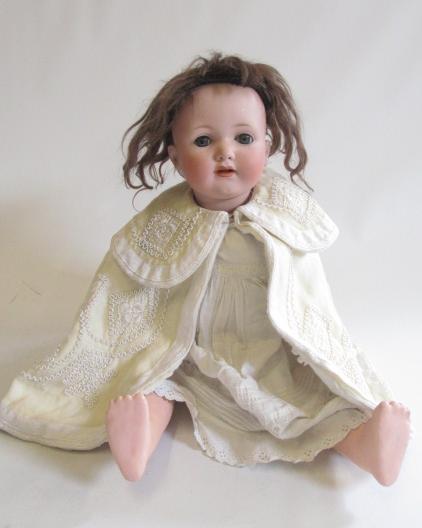 A Melitta bisque socket head doll with blue glass sleeping eyes Image