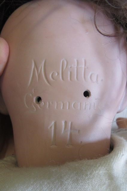 A Melitta bisque socket head doll with blue glass sleeping eyes Image