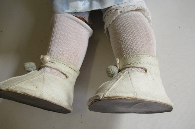 A Schoenau & Hoffmeister bisque socket head doll Image