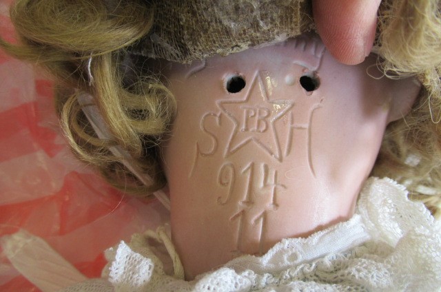 A Schoenau & Hoffmeister bisque socket head doll Image