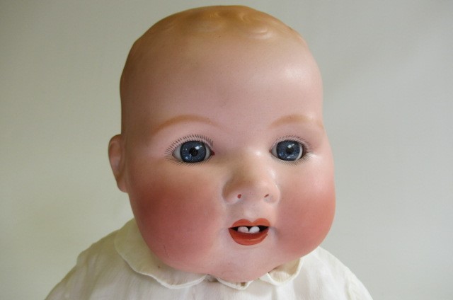 An Armand Marseille Dream Baby bisque socket head doll Image
