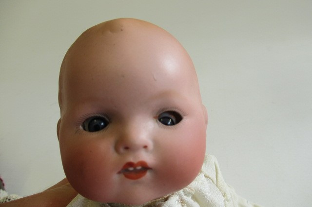 An Armand Marseille bisque head baby doll Image