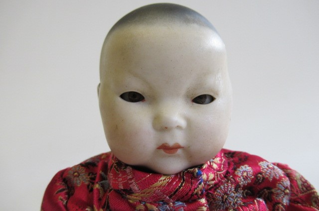 A German Oriental baby bisque head socket doll Image