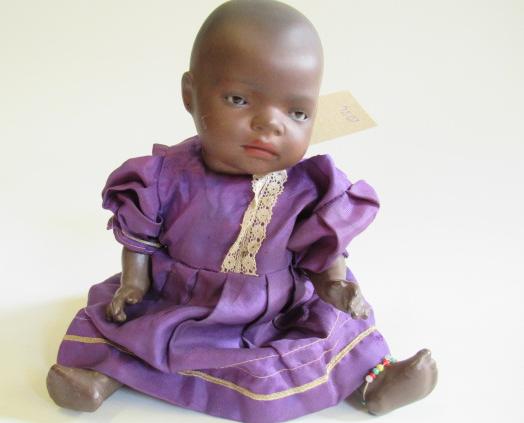 A Heubach bisque socket head mulatto baby doll Image