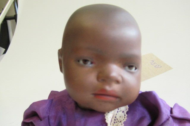 A Heubach bisque socket head mulatto baby doll Image