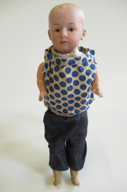 A Heubach solemn boy character bisque socket head doll Image