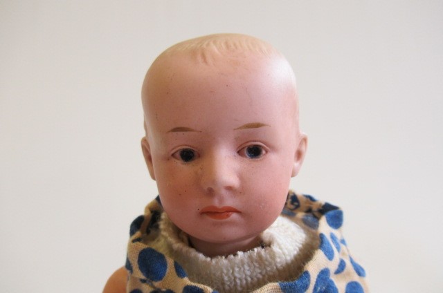 A Heubach solemn boy character bisque socket head doll Image