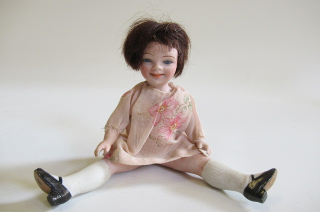 A small German all bisque character doll Image