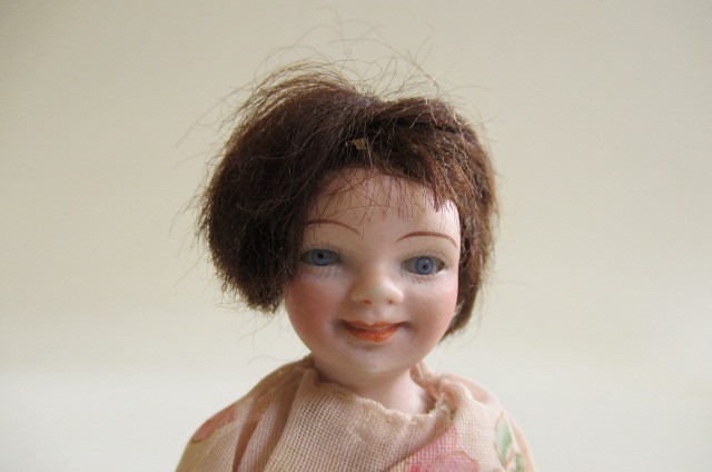 A small German all bisque character doll Image