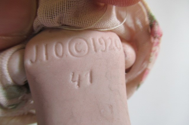 A small German all bisque character doll Image