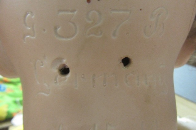 An Armand Marseille bisque socket head doll with brown glass sleeping eyes Image