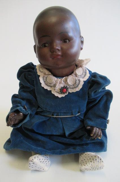 A bisque socket head mulatto baby doll Image