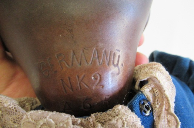 A bisque socket head mulatto baby doll Image