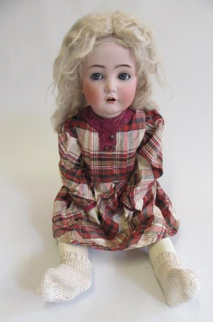 A Kammer & Reinhardt bisque socket head flirty doll Image