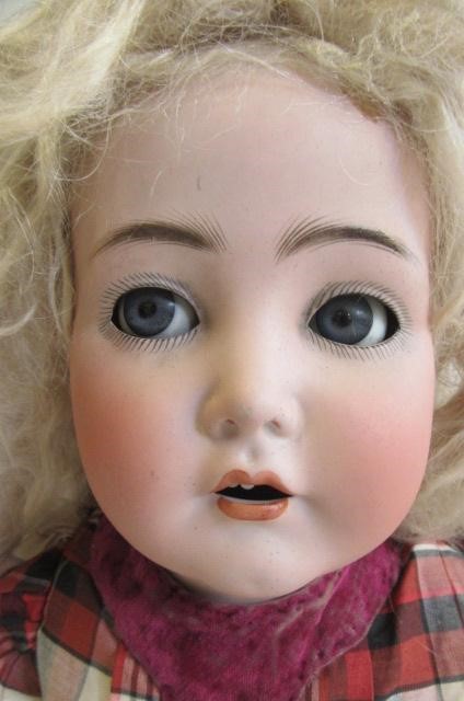 A Kammer & Reinhardt bisque socket head flirty doll Image